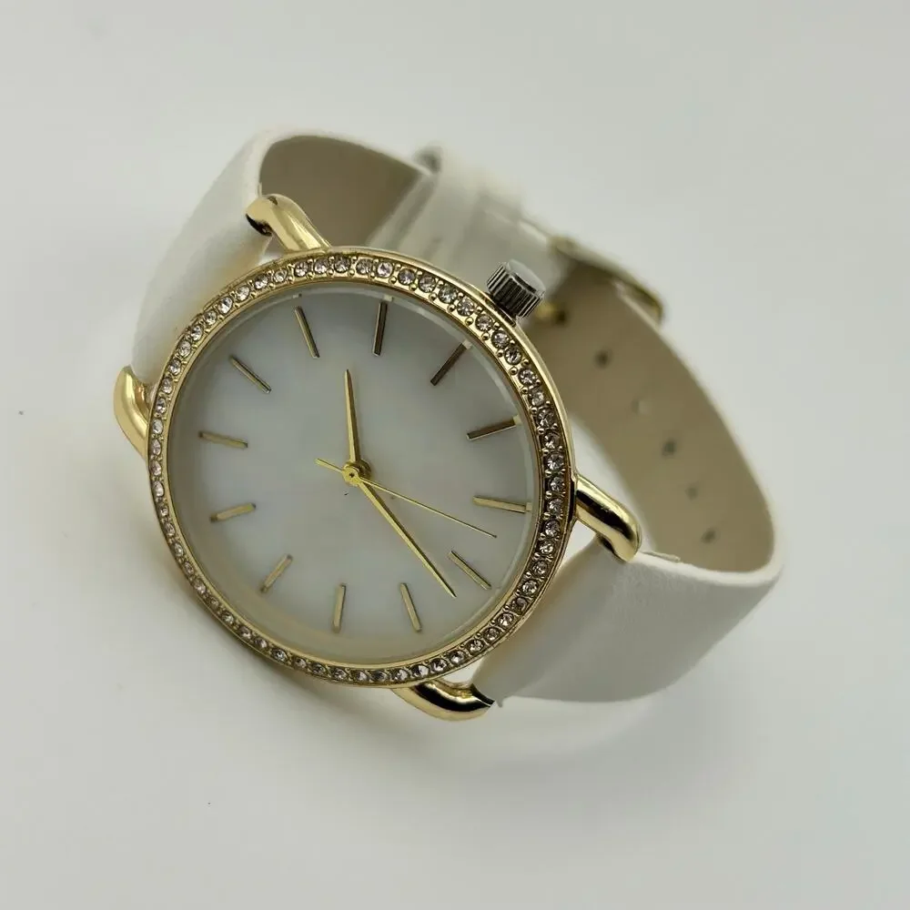 Women’s Gold-tone Crystal Bezel Mother Pearl Dial White Band Minimalist Watch
